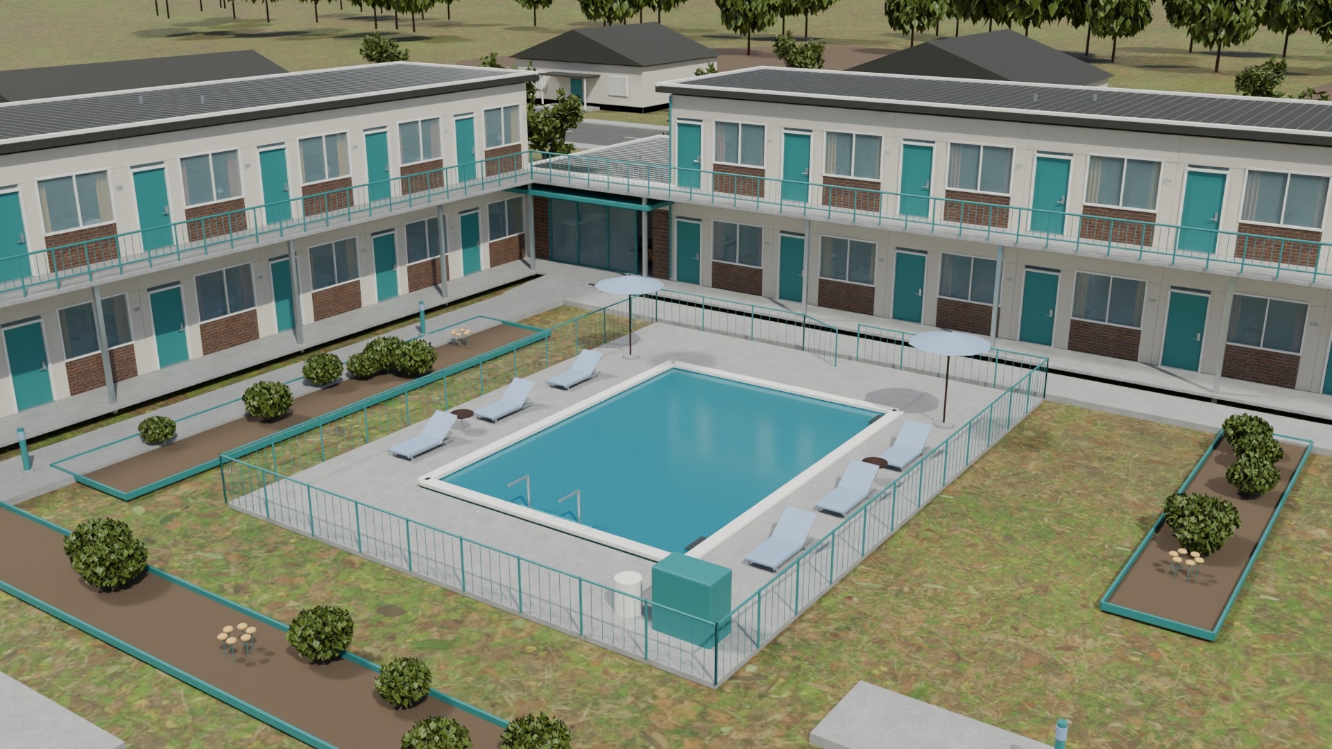 An outdoor pool, portable loungers and planted guest paths inside the L-shaped motel courtyard.